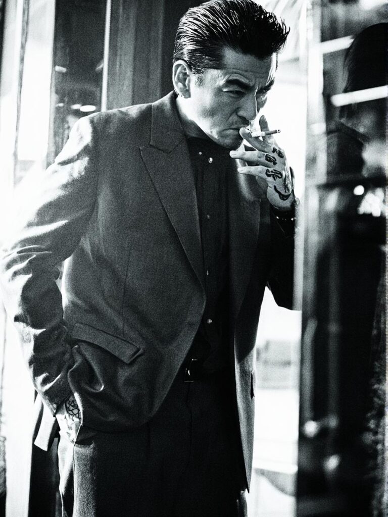 black and white cinematic portrait of a man smoking, created with WeShop Z-Image AI Image Generator, realistic vintage photography style