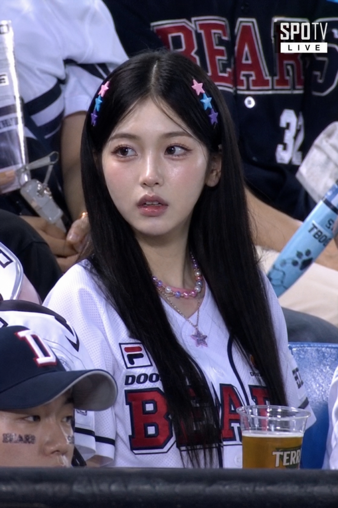 cc – WeShop AI Blog Stylized girl transformed into a realistic baseball broadcast fan by the gpt image2 engine.