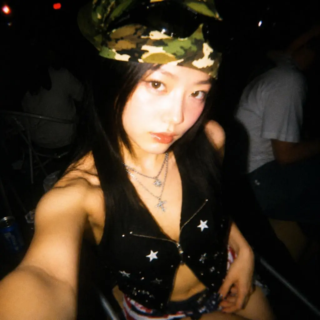 Selfie transformed with Digital Camera Filter Online into a flash-lit, grainy 2000s digital camera photo.
