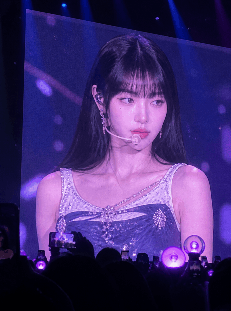 K-pop concert screen AI result showing a black-haired idol on a giant LED jumbotron