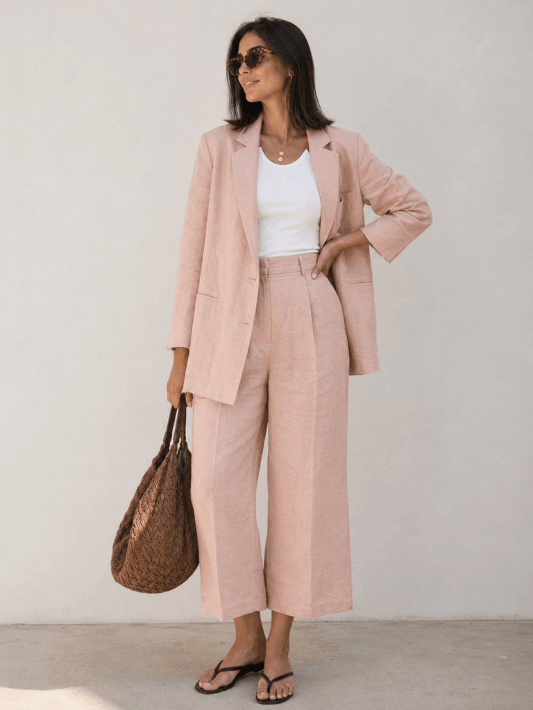 AI virtual try-on result showing a soft pink suit outfit with relaxed tailoring and a clean fashion look.