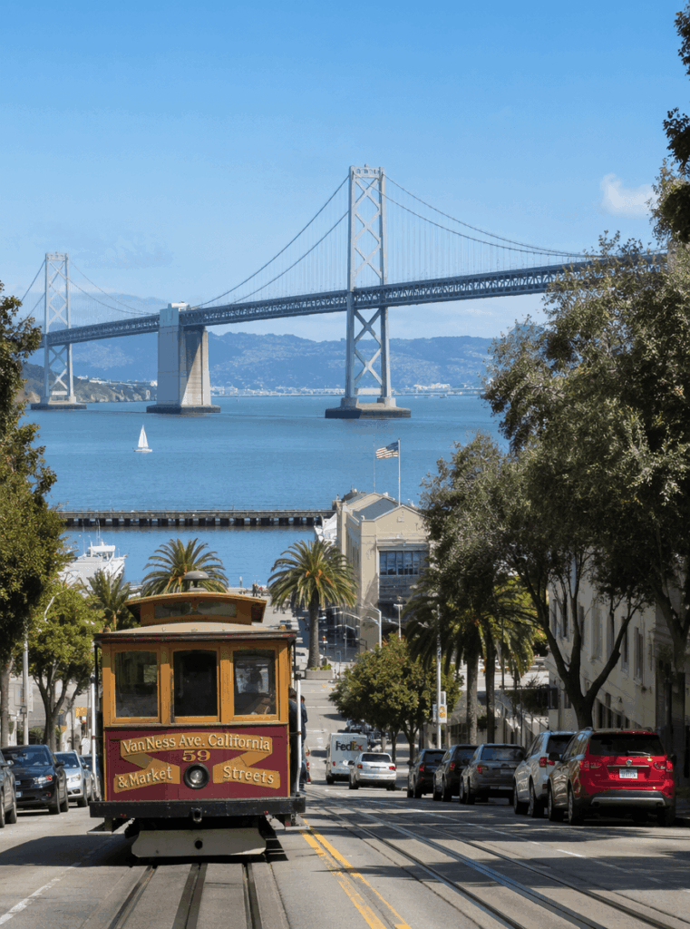 Original San Francisco cable car photo with Bay Bridge in the background