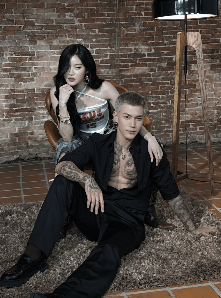 纹身22 – WeShop AI Blog Stylish man with AI-generated chest and arm tattoos that naturally follow his muscles and body structure.