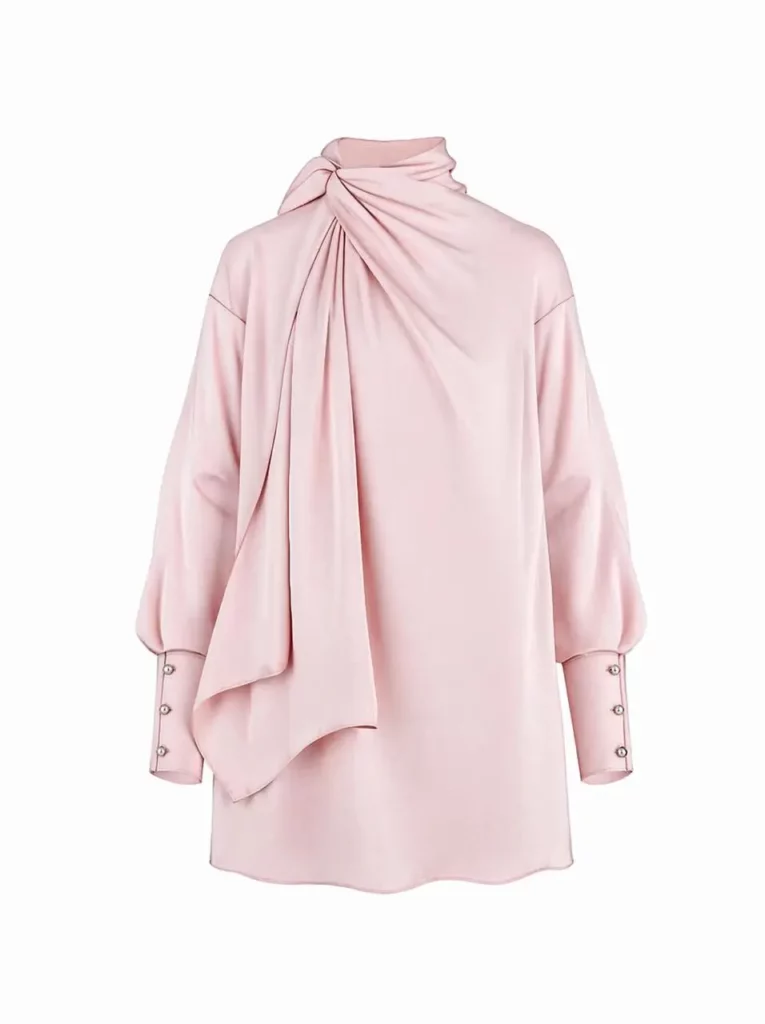 01db319b-9eb3-4b7f-9ee0-c1020ab9e39e_956x1280png_preview – WeShop AI Blog Realistic pale pink high-neck blouse created from a fashion sketch, featuring soft draping, long sleeves, and buttoned cuffs.