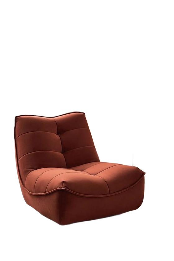 Rust-colored lounge chair isolated on a white background with clean edges and a natural shape.