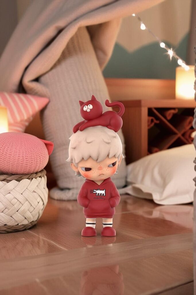 Small red-clothed collectible figure in a tightly cropped cozy bedroom scene before AI Image Expander.