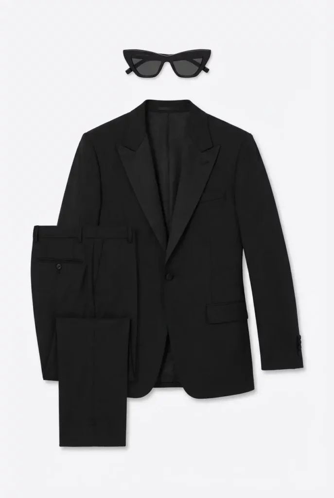 a788d9f9-cbbb-486b-ac74-76e0013fb3a8_848x1264png_preview – WeShop AI Blog AI Clothing Piece Generator flatlay of a black suit, trousers, shirt, and sunglasses