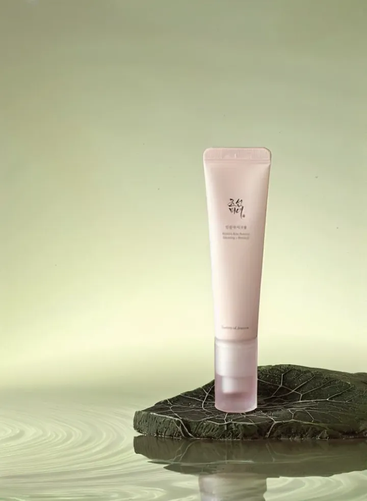 magic-eraser-guide-01-02 – WeShop AI Blog Clean skincare product photo with the distracting branches removed while preserving the tube, stone platform, water, and reflections.