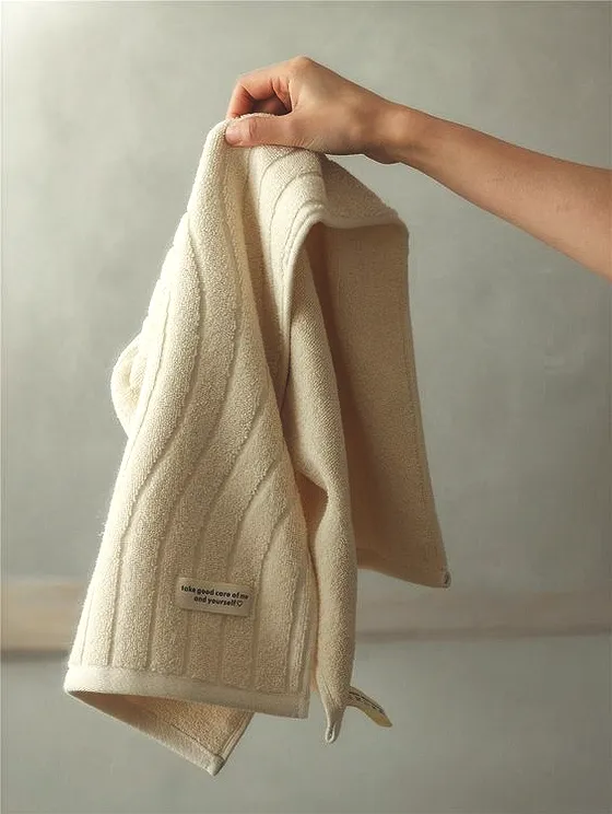rlt – WeShop AI Blog Cream towel with brighter natural light after AI Relight Tool enhancement.
