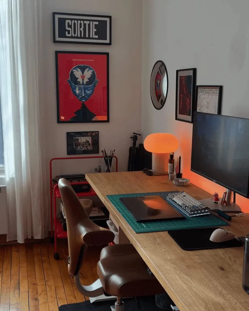 38ef0c0a-1c0a-4dc4-817f-f413b6010ec8_1024x1280png_preview – WeShop AI Blog Modern home office with a wooden desk, orange lamp, computer monitor, and framed wall art before Plog editing.