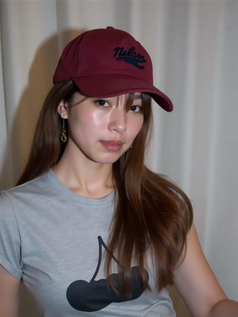 mew – WeShop AI Blog Clean portrait of the same woman after the unwanted white text was removed from her gray T-shirt.