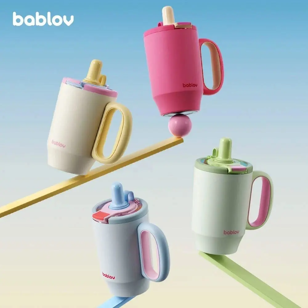pa3 – WeShop AI Blog Four Bablov kids training cups in coordinated pink, cream, green, and blue color variations.